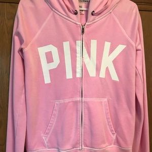 Pink zip up jacket.